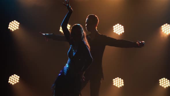 Rumba Drive Dance Performed By Pair of Ballroom Dancers