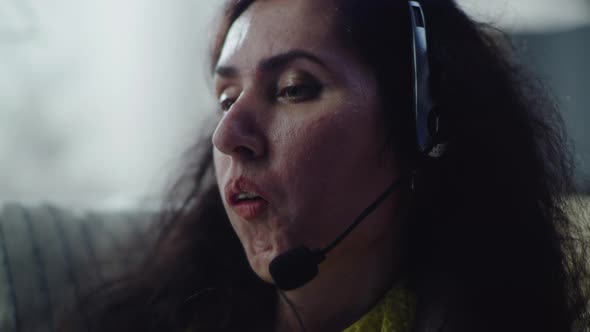 Woman with a Disability Talking Using Headset