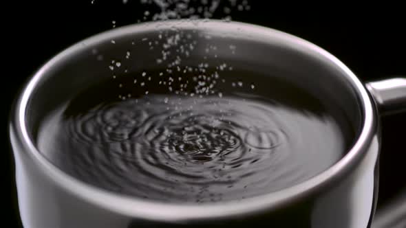 Pouring sugar into coffee, Slow Motion