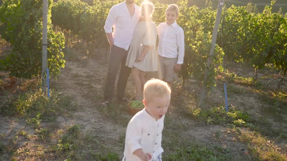 Family of Three in White Clothes Stands