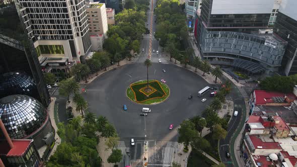 La palma roundabout in Mexico city on aerial footage by drone. Paseo de la reforma street with cars