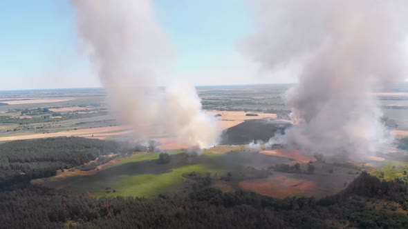 Aerial View of Fire in Wheat Field. Flying Over Smoke Above Agricultural Fields