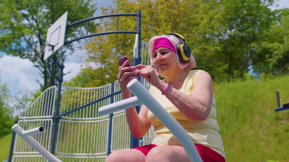 Senior Woman After Sport Training Listening Music on Playground Celebrate Win Doing Winner Gesture