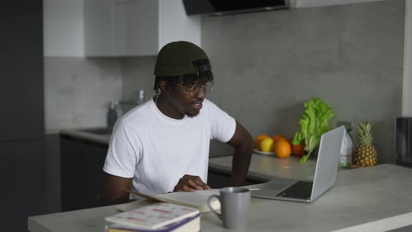 Focused African Black Male Student Using Laptop Prepare for Test Exam