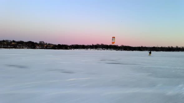 wind surfing over a frozen lake, winter sports in North America