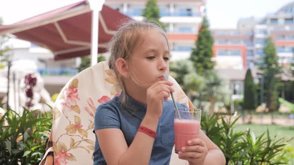 Child Girl Drinking Cocktail on Tropical Beach Resort