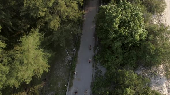 Aerial view of a group pedaling bicycles, Gili Trawangan, Indonesia.