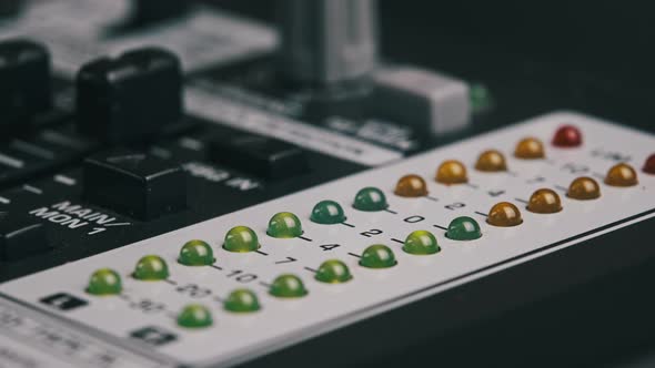 Macro Shot of Stereo LED Indicator on Mixing Console with Pulsating Sound Level