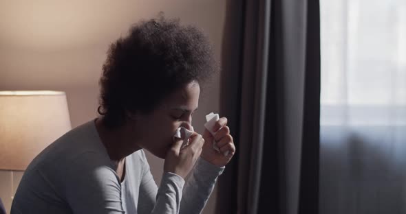 Sick Black Woman Blowing Nose