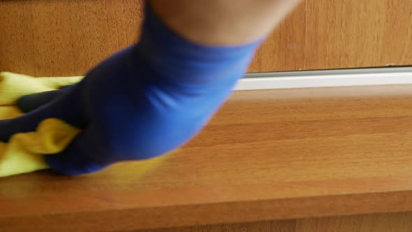 Wiping A Shelf Of A Compatment Wardrobe
