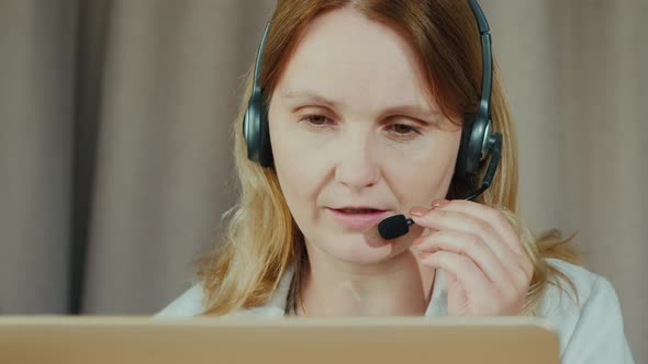 Portrait of a Woman Communicating Through a Headset