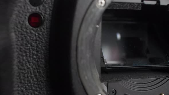 Close Up Of Open DSLR Camera Mirror. Pan Right