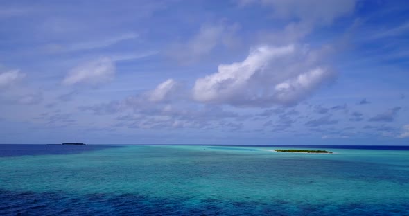 Luxury overhead island view of a paradise sunny white sand beach and aqua blue water background