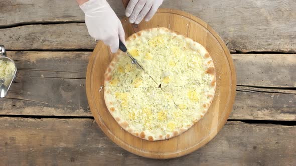 Hand Chef Cutting Pizza