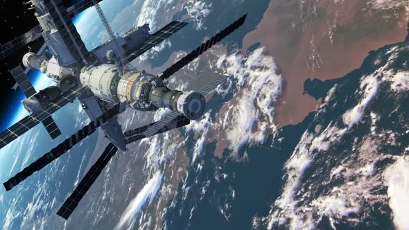 Flight Of The Space Station Above The Earth alt