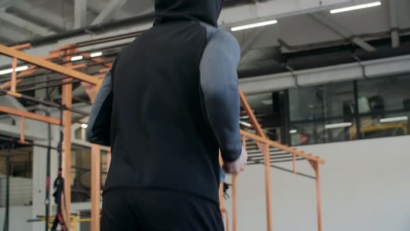 Back View of Man in Sportswear Running Indoors