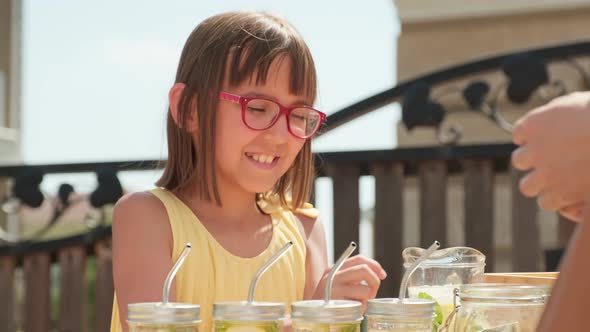 Little Girl Selling Lemonade Outside