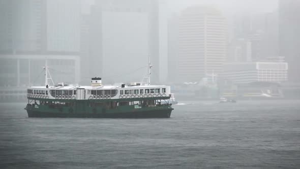 Star Ferry Sailing in the Victoria Harbour with extreme fog in Hong Kong, Slow Motion