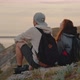 A Guy and a Girl Sit on Top of a Mountain and Look at Nature - VideoHive Item for Sale