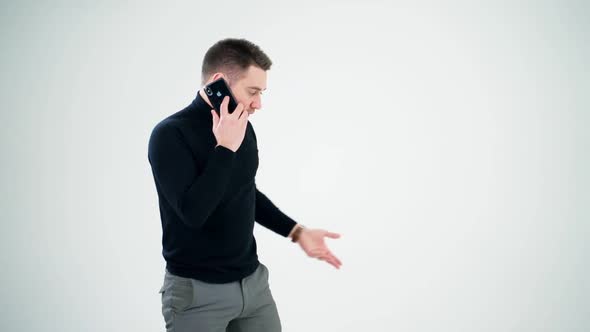 Handsome man having phone talk indoors