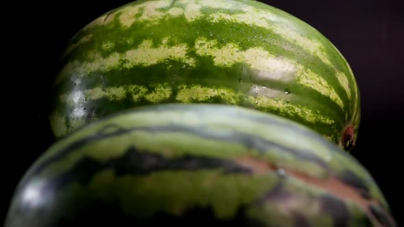 Two Fresh Tasty Watermelons Rolling