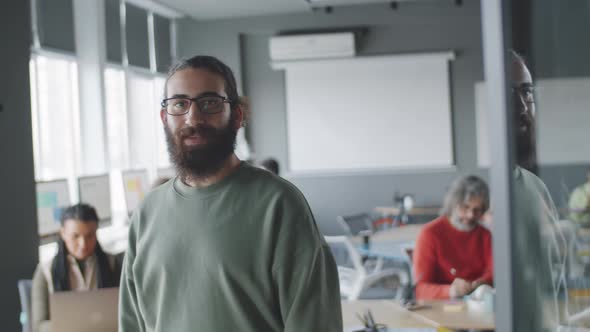 Mixed Race Male Office Worker Smiling and Posing for Camera