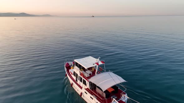 Sunrise Fishing boat goeas to sea aerial view Turkey Alanya 4 K