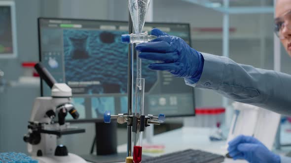 Science Specialist Using Chemical Test Tube in Laboratory