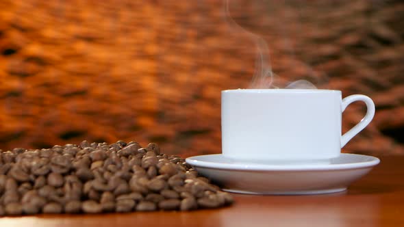 Cup on a White Saucer of Hot Coffee on the Aroma Spreads Room