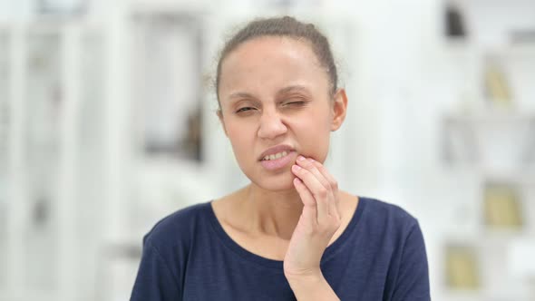 Portrait of Young African Woman Having Toothache 