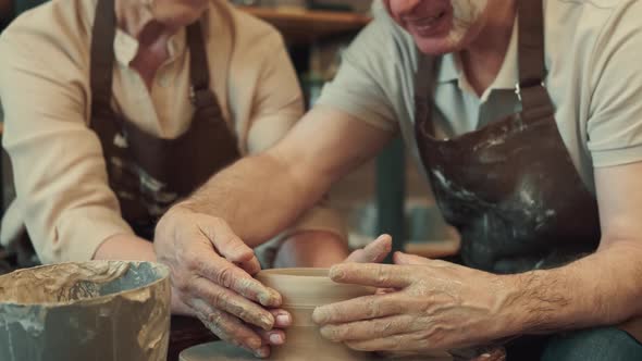 Loving Couple Senor Man and Senor Woman are Enjoying Themselves During the Pottery Art