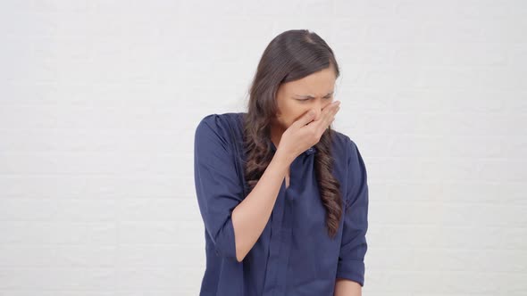 Indian girl disgusted by bad smell