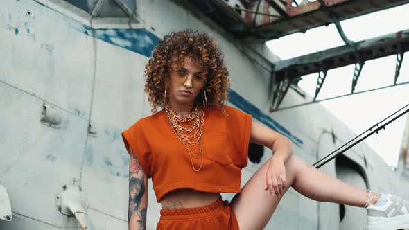 Vogue Style Portrait Beautiful Afro Curly Woman Is Looking To Camera Seriously