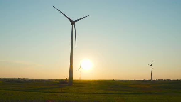 Wind generators at sunset