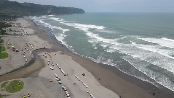 Aerial view of Sandy beach in sunny day in Yogyakarta, Indonesia