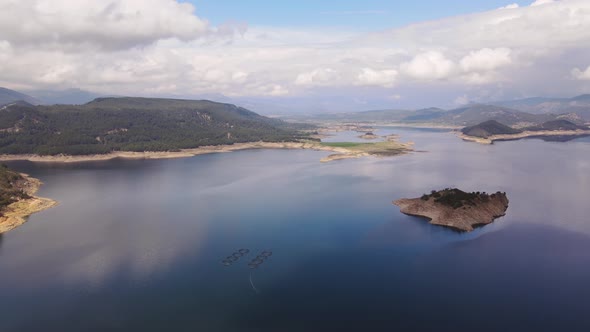 Aerial view of island in Karacaoren Dam Lake in mountain in Antalya province