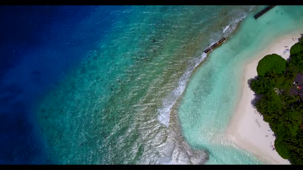 Aerial top view texture of idyllic coastline beach trip by clear ocean and white sand background of 