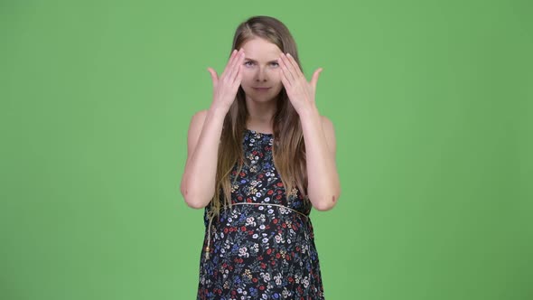 Young Beautiful Pregnant Woman Covering Eyes As Three Wise Monkeys Concept