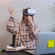A Girl in Virtual Reality Glasses Is Fooling Around Creating a Mood - VideoHive Item for Sale