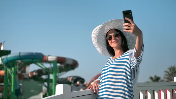 Relaxed Tourist Young Woman Smiling Taking Selfie at Luxury Resort Aquapark Sky Background