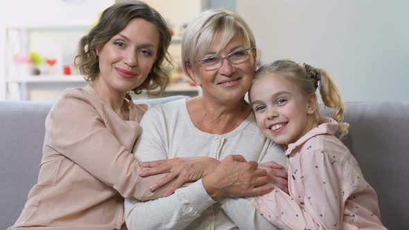 Portrait of Three Generations of Women Smiling at Camera, Happy Family Together