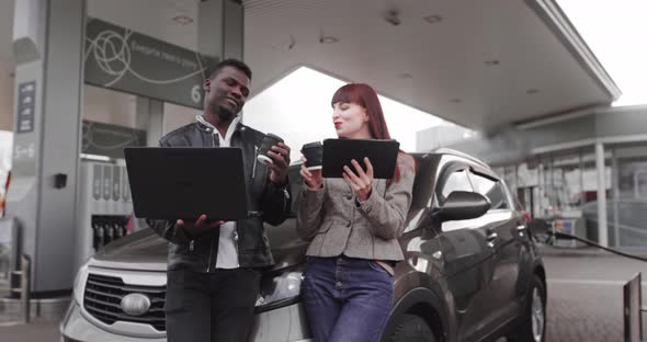 Business Couple Caucasian Woman and African Man Looking Each Other with Smile