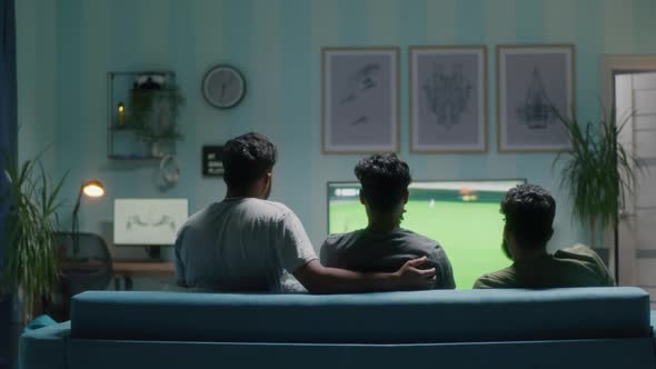 Football Fans Celebrating Goal in Living Room