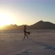 Girl in Red Dress Sunset Salt Flats Mountain Drone Shot 4K - VideoHive Item for Sale