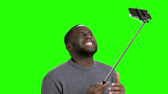 African American Man Using Monopod