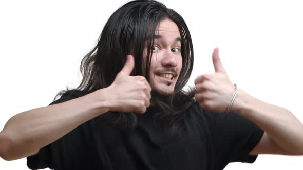 Closeup of Cheerful Eastasian Male Rocker Guy with Long Hair and Moustache Jumping From Bottom with