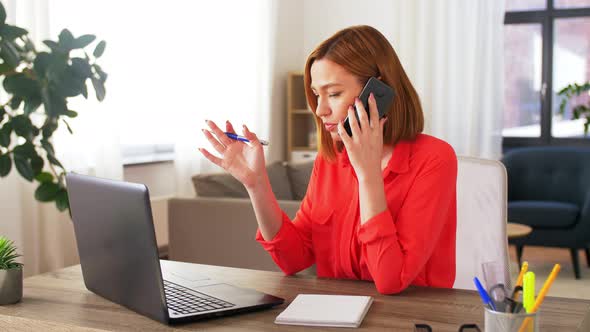 Woman Calling on Smartphone at Home Office