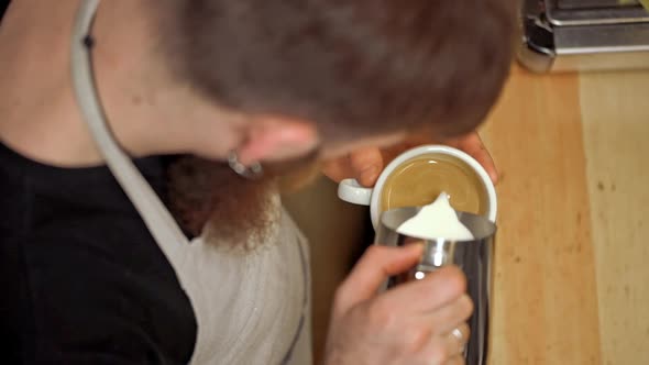 Barista Making Coffee in Coffeeshop