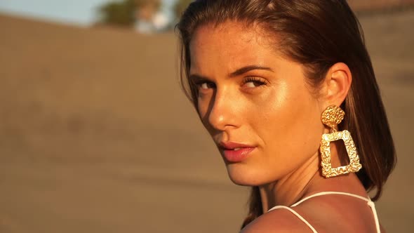 Closeup Shot of Beautiful Model with Sand Dunes in Background