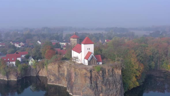 Church Overlooking a Small Lake on a Foggy Morning in Germany